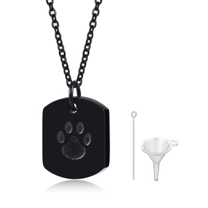 Close-up of black urn necklace with paw print including mini funnel and needle tool set