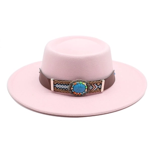 Detail of pink wide brim flat top hat with ethnic woven band and turquoise stone
