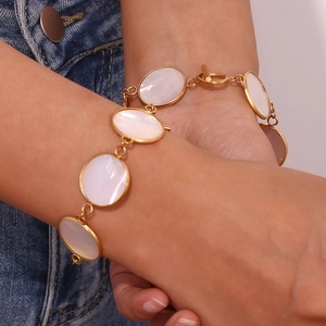 18K gold plated stainless steel bracelet with white shell circles and OT toggle clasp