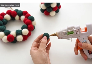 DIY process of making Christmas wool felt ball wreath with red and green ornaments