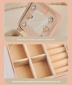 Macro detail of pink PU leather jewelry box with mirror and soft beaded velvet lining