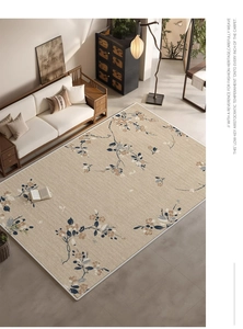 Detail of beige floral rug with blue patterns and high-quality woven edge finish