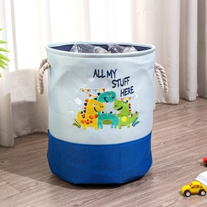 Detail of canvas toy organizer with dinosaur embroidery and thick rope handles