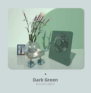 Detail of minimalist desktop USB fan in blackish green with protective radial grille