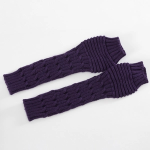 Detail of dark purple cable knit arm warmers showing texture and elastic ribbed cuffs
