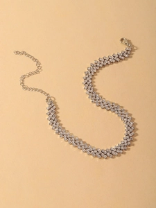 Detail view of a multi-layer silver choker with sparkling rhinestones and extender chain