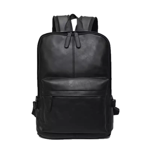 Minimalist black PU leather travel backpack for men featuring a sleek modern design