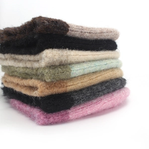 Close-up of knit texture on colorful warm winter bucket hats with a soft fleece finish