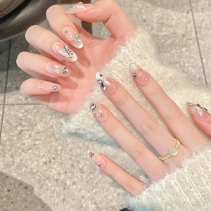 Handmade almond press-on nails with cat-eye blush effect, 3D butterfly, and pearl accents