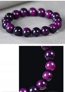 Macro detail of polished purple Bodhi root beads with natural textures and high gloss finish