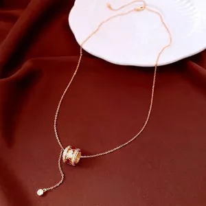 Gold plated gourd pendant necklace with sparkling zircons and red enamel detail