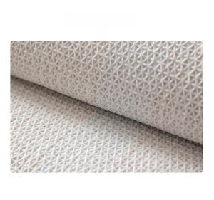 Detail of TPR rubber backing with anti-slip geometric texture for bathroom floor mats