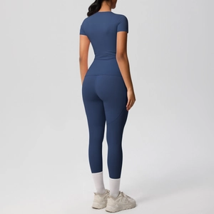Rear view of navy blue high-stretch yoga set with slim fit t-shirt and leggings