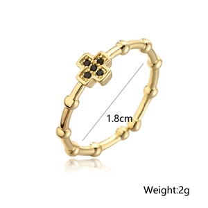 Detail view of 18K gold plated cross ring with black zircon and dimensions 1.8cm 2g
