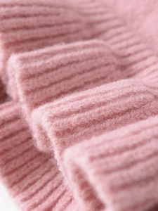 Macro detail of pink ribbed knit texture with soft mohair yarn finish and fuzzy feel