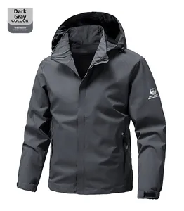 Detail of dark grey waterproof hooded outdoor jacket with logo and zip pockets