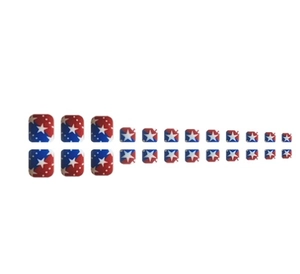 Detail of red and blue press-on toenails with white stars and dots pattern