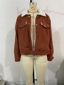 Detail of retro corduroy jacket with white sherpa collar and metal snap buttons
