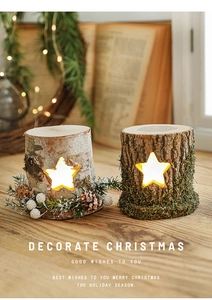 Close-up of star-shaped cutouts on wooden Christmas stump lights with warm LED glow