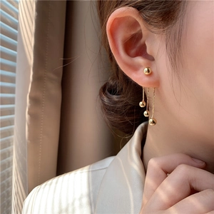 Elegant gold triple bead tassel earrings for women featuring a long metallic fringe design