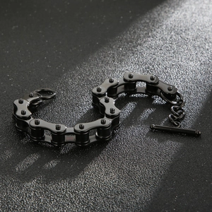 Close-up of black stainless steel bike chain bracelet with OT toggle clasp and matte finish