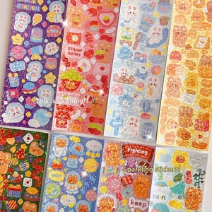 Detailed macro view showing sparkling glitter texture and holographic laser effect on cute DIY stickers