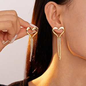 Gold heart fringe earrings with sparkling rhinestones for a minimalist aesthetic