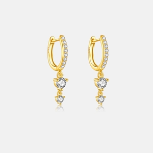 Close-up of S925 sterling silver gold earrings with round white zircon stones and hallmark