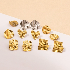 Detailed view of assorted 18k gold and silver plated irregular wrinkled earrings