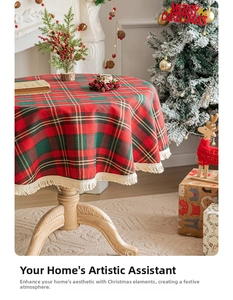 Close-up of festive red and green plaid tablecloth with white fringe for Christmas decor
