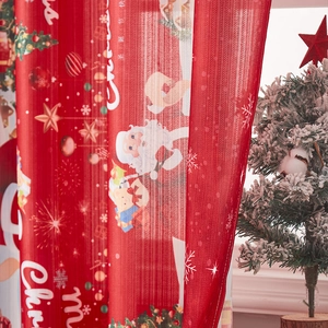 Close-up of red Christmas mesh curtain featuring Santa Claus and Merry Christmas prints