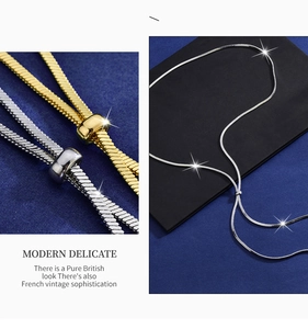 Detail of adjustable flat snake chain with slider bead in gold and silver finish