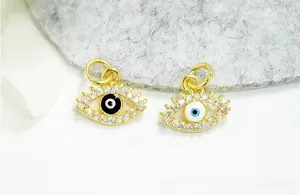 Detailed view of 18K gold-plated Evil Eye pendants with pavé zircon and enamel finish