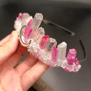 Detailed macro of pink and white natural crystal crown headband with silver moon pendant
