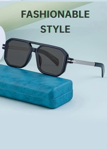 Detail view of polarised square sunglasses with silver metal temples on a leather case