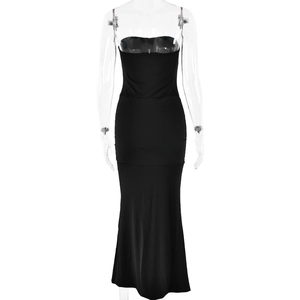 Close-up of black strapless evening dress featuring a slim fit mermaid cut and ruched detail