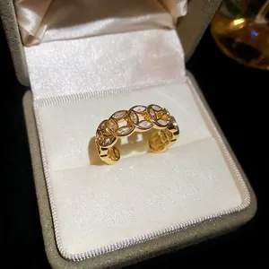 18k gold plated open ring with hollow circular links and cubic zirconia stones in a gift box