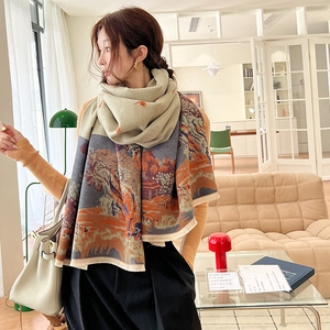 Detail of vintage landscape pattern on thick cashmere scarf with decorative tassels