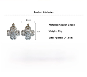 Detail view of clover earrings with white zircon inlays and copper base, size 2.0x1.5cm