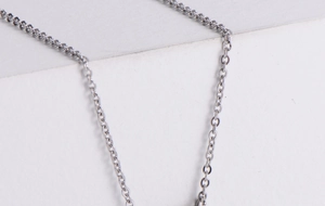 Detailed macro view of silver titanium steel chain link texture and polished finish
