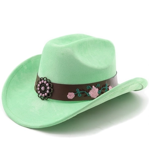 Detail of mint green suede cowboy hat with floral embroidery and vintage metal buckle