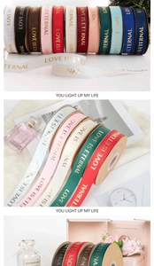 Detailed views of 2.5cm gold-stamped ribbons with Love is Eternal text for gift wrapping