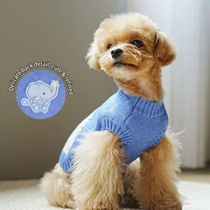 Blue knit pet sweater with elephant embroidery for small dogs in a cozy home setting