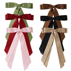 Set of six colorful satin bow hair clips with long ribbons in assorted elegant shades