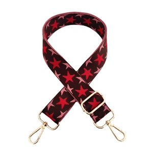Adjustable wide replacement bag strap with red stars on dark brown nylon fabric