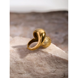 Macro detail of 18k gold plated stainless steel teardrop ring with textured twist design