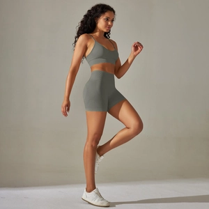 Close-up of grey seamless ribbed yoga set showing side detail on high waist shorts