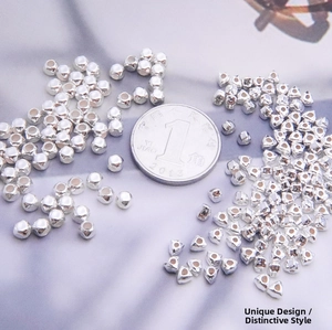 Macro detail of S925 sterling silver geometric spacer beads for DIY jewelry making