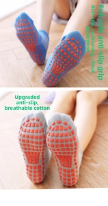 Detail view of cotton non-slip socks with thickened orange square rubber grips on soles