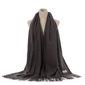 Dark grey cashmere-feel winter scarf with elegant tassels and soft warmth design.